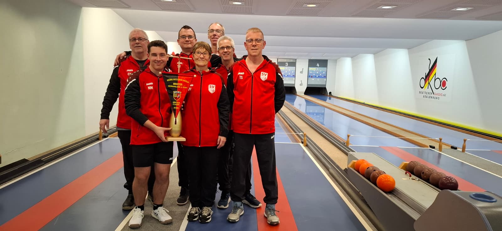 Gemischte Teamfoto